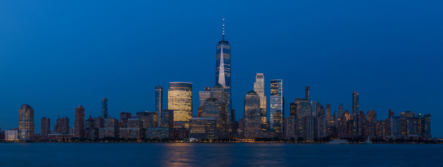 View to Lower Manhattan Skyline from Exchange Place in Jersey City at sunset.