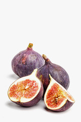 Ripe juicy figs on a white background.
