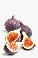 Ripe juicy figs on a white background.