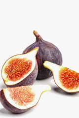 Ripe juicy figs on a white background.