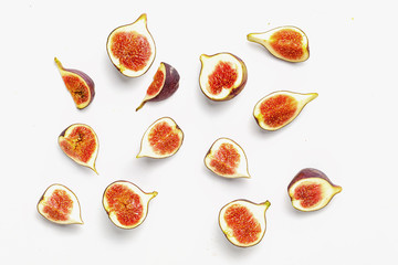 sliced ripe juicy figs on a white background. Top view.
