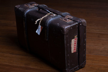 Old suitcases on a wooden floor