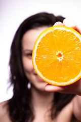 beautiful young woman with oranges