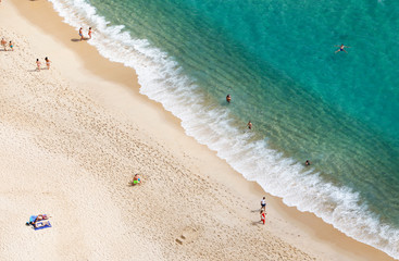 Nazare, Leiria, Portugal - July 01, 2019: Tourists enjoy Nazare Beach, from the viewpoint of Suberco, in the Leiria District, in Portugal.