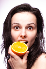 beautiful girl with oranges smiling