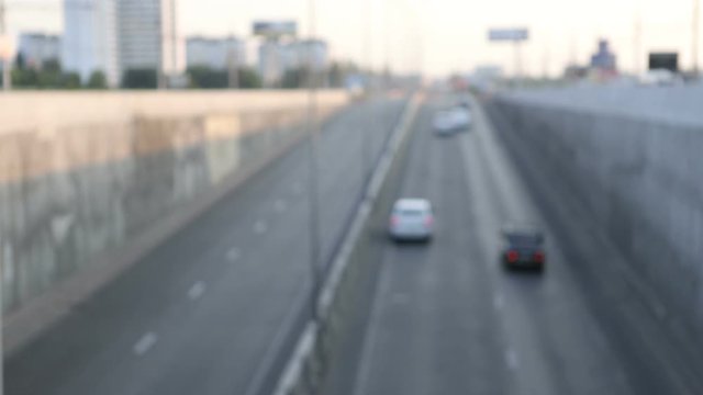 view of urban car traffic early in the morning, defocus makes beautiful bokeh from the included headlights, general plan