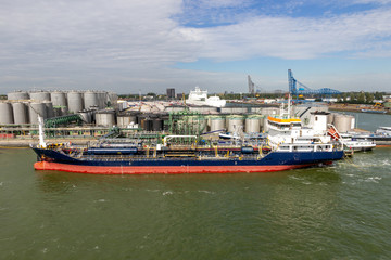 Oil tanker moored at a silo tank terminal in the Port of Rotterdam.