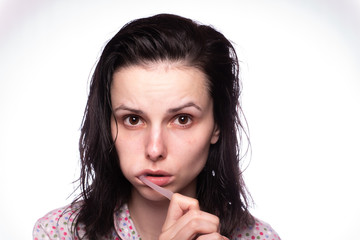 Fototapeta premium beautiful young woman cleaning teeth