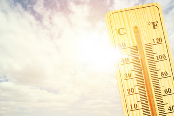 Thermometer in very hot day, high temperature or warm environment concept. thermometer in the sky, the heat