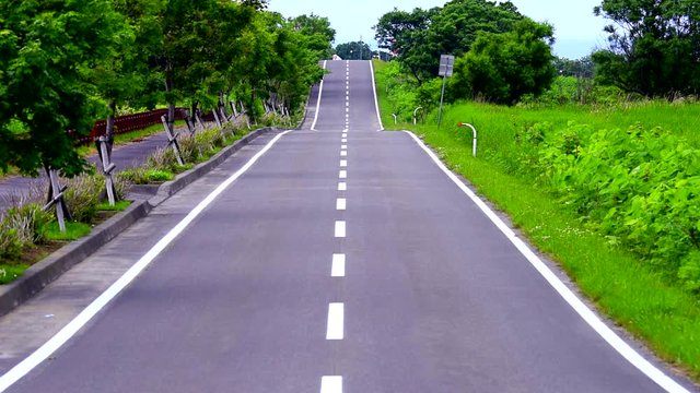 Real time shot of empty road in summer