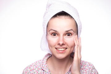 beautiful girl in a towel on her head, with patches under her eyes