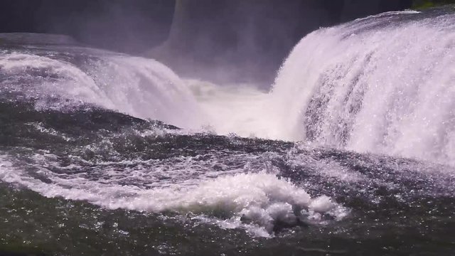 Lockdown shot of rapid water stream in Fukiwareki Waterfall