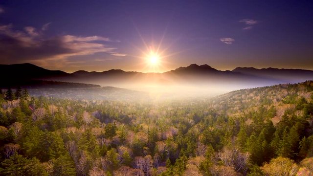 Sun illuminating hills covered in fog, Kamishihoro, Hato, Hokkaido