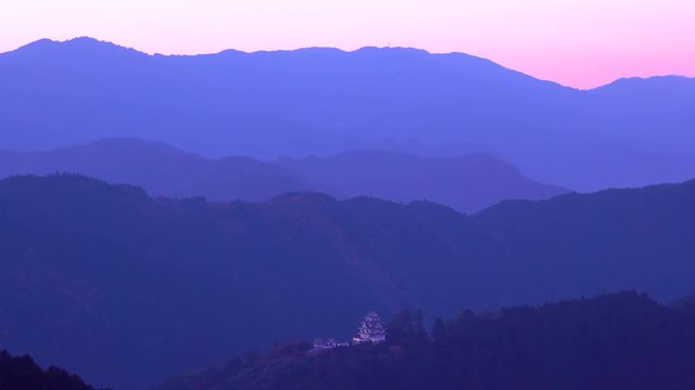 Gujo Hachiman Castle in mountains at sunset in autumn, Japan