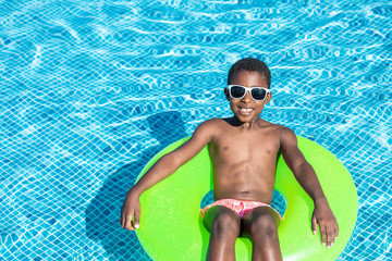 kids smiling and happy at the pool