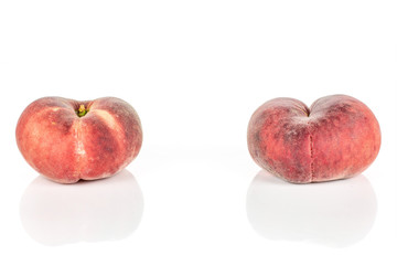 Group of two whole fresh red peach prunus persica platycarpa isolated on white background