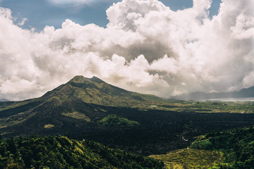 Panoramic landscape of Batur volcano and clouds on Bali island, Indonesia
