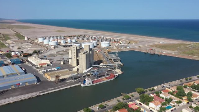 Grain silos grain elevator and stockage tankers aerial shot Port-la-Nouvelle Occitanie Aude harbor