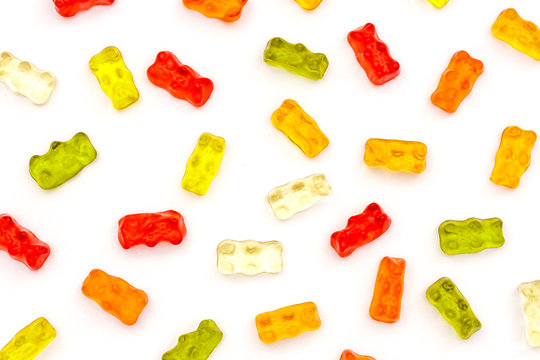Pattern of colorful fruit gummy bears isolated on white background