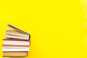 workplace with books on yellow background flatlay mockup