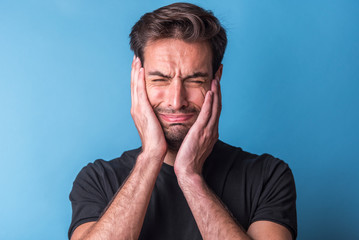 Depressed and crying young guy