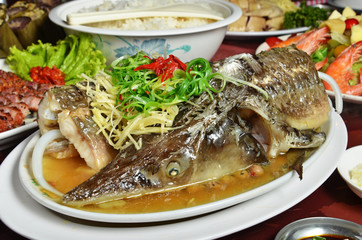 Steamed sturgeon with soya sauce, Chinese food menu. served on white plate