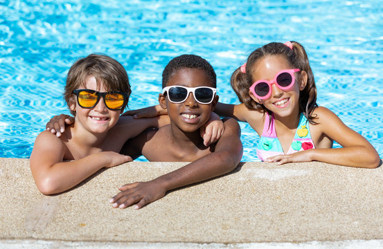 kids smiling and happy at the pool