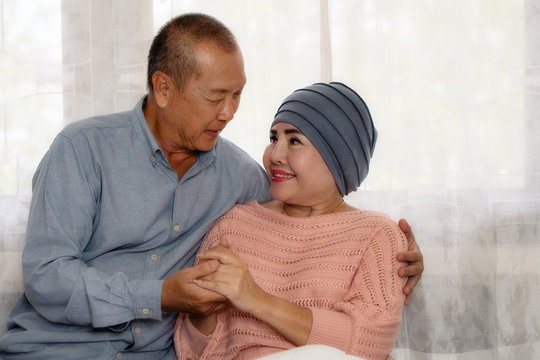 asian senior couple having encouragement when wife having cancer and being treat with chemotherapy