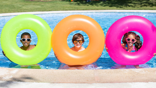 kids smiling and happy at the pool