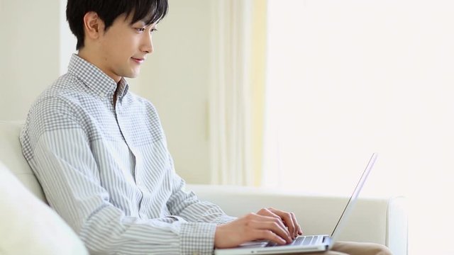 View of young man working with laptop
