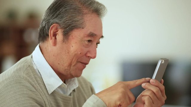 Senior man using phone