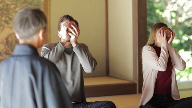 Tourist couple during tea ceremony, Kyoto, Japan