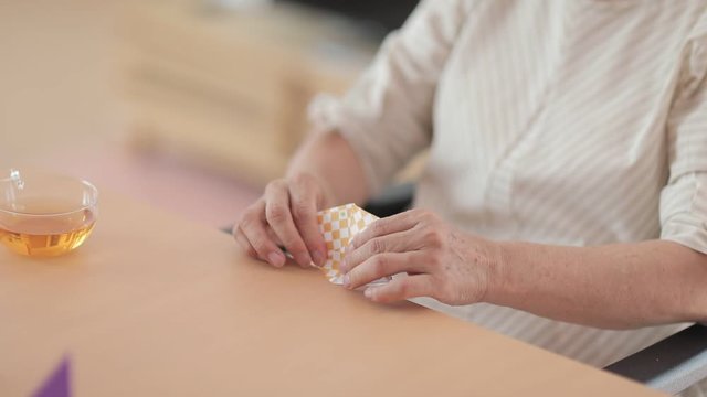 Senior woman making origami