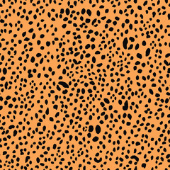 Seamless black and orange leopard animal skin pattern vector