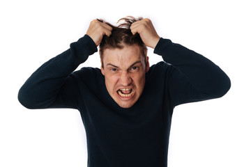 Fototapeta premium emotional portrait of a crazy man in close-up. concept: the nervous breakdown, mental disease, headaches and migraine. isolated on white background.
