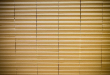 Old yellow or beige with striped curtain nice texture pattern in row on the wall separate column,look like paper curtain in Japanese style ,good for a wallpaper background design