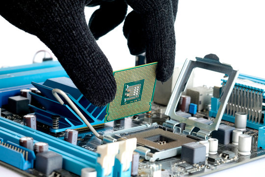 Hand of computer engineering brings computer cpu processor memory change components into socket processor for maintenance.Technology and development concept
