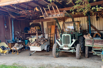 Fototapeta na wymiar Old Tractor in a shed