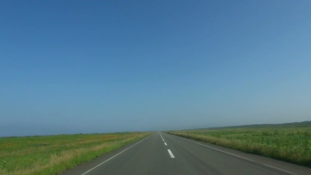 POV shot of empty road under clear sky, Sarumo, Hokkaido