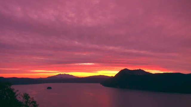 Timelapse of clouds flowing over Lake Mashu at sunrise, Japan