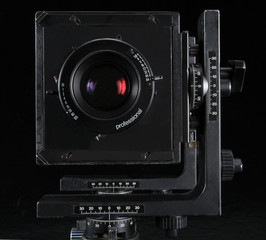 Fototapeta na wymiar film camera on black background