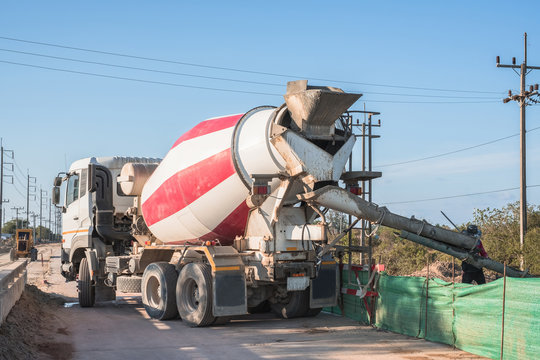 Cement mixer truck at work for pouring cement at construction site