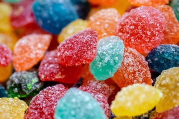 a lot of colorful round candy in the sugar macro