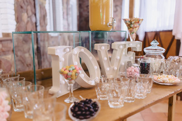 sweet festive buffet, fruit, caps, macaroni and lots of sweets