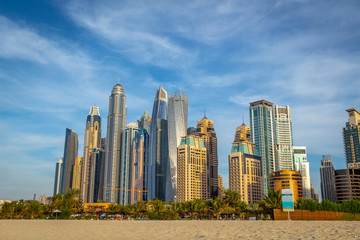 Fototapeta na wymiar View of the high-rise buildings of Dubai from the beach. Dubai Marina district. 2018.