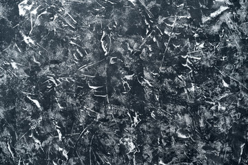 Background black stucco with traces scuffing, white spots and scratches.