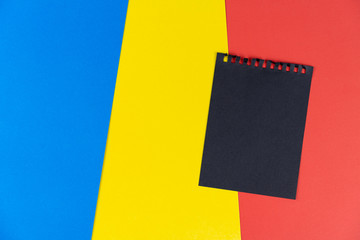 Black list Romania. Mourning, ban, sanctions, politics. black sheet of notebook lies on Romanian...