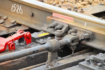 The mechanism of a modern operating railway arrows close-up.