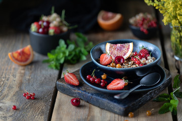 Homemade pumpkin muesli with nuts and seeds in a glass jar for a healthy breakfast. Autumn still life. Dark photo