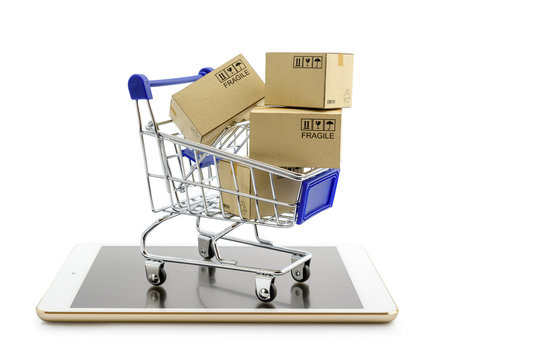 Online shopping or ecommmerce and international freight service concept : Paper boxes with logos in a shopping cart on a white smart mobile phone device. Consumers always shop goods using the internet